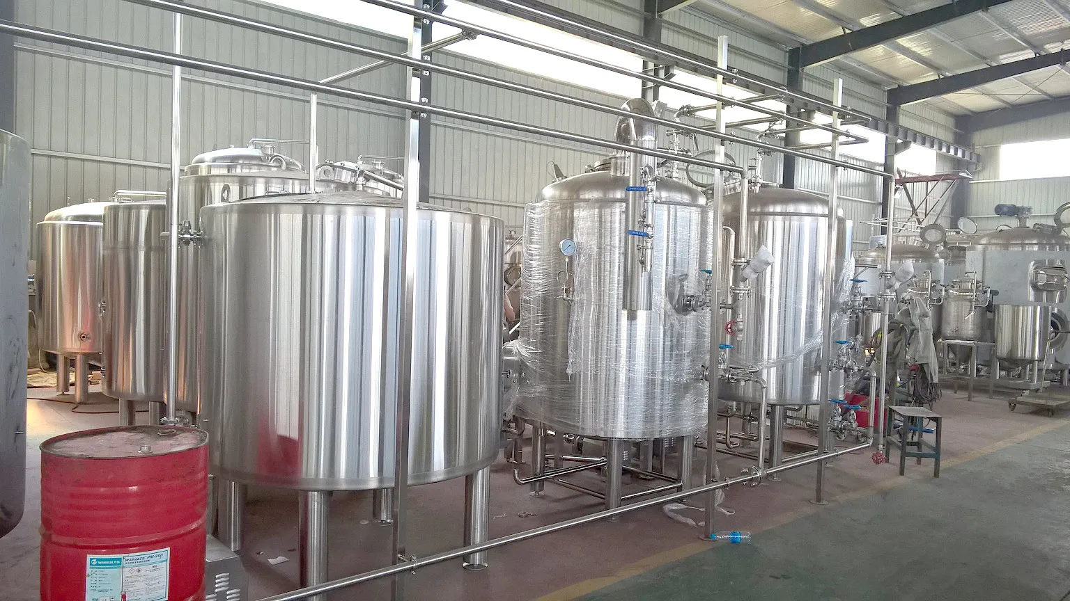 Stainless steel fermentation tanks at Brasserie Irvoy 20HL manual brewery