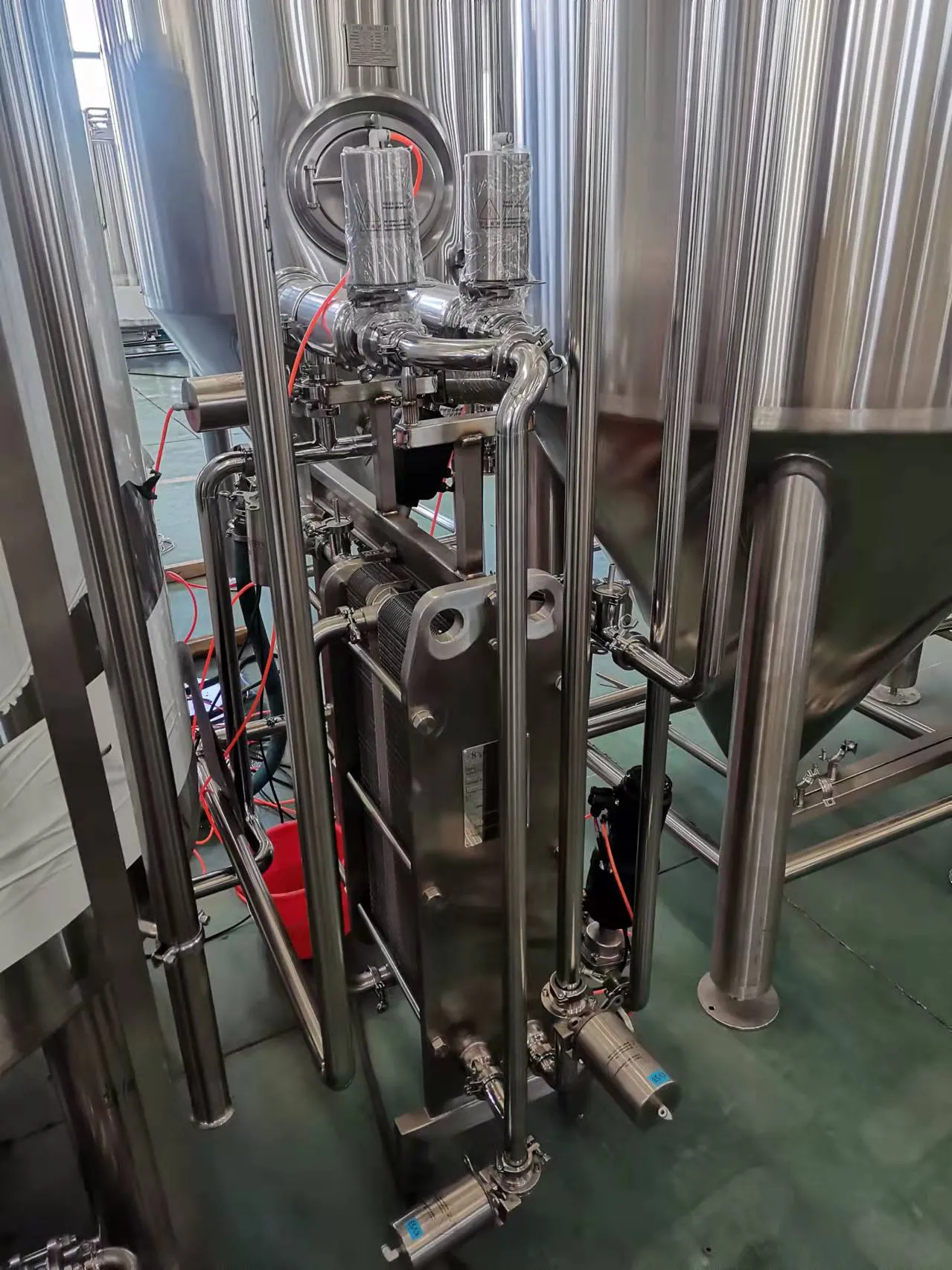 Deeper Roots Brewing beer cafe interior with visible 10HL brewing area