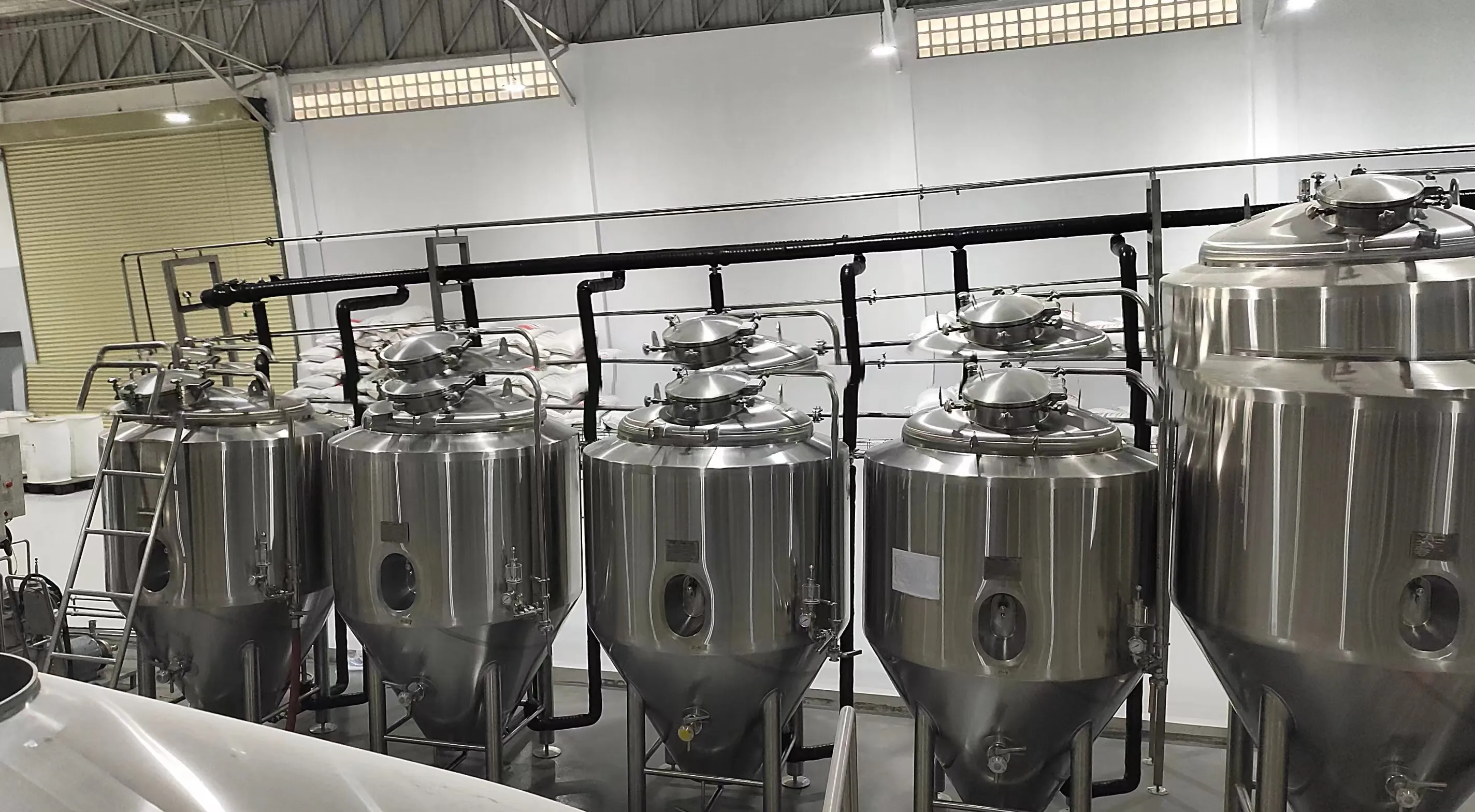 GRAND DIAMOND BREWERY taproom with visible 10HL brewing area
