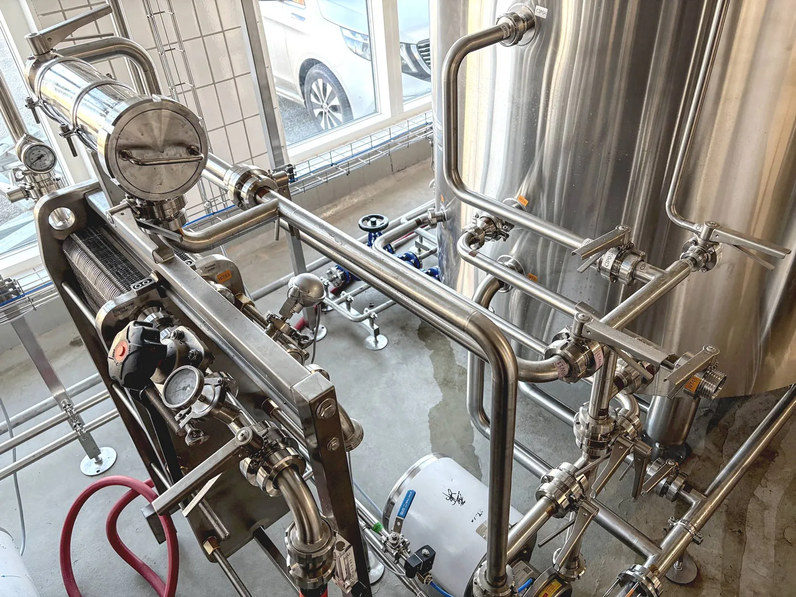 Hvide Sande Bryghus waterfront taproom with visible 10HL brewing area