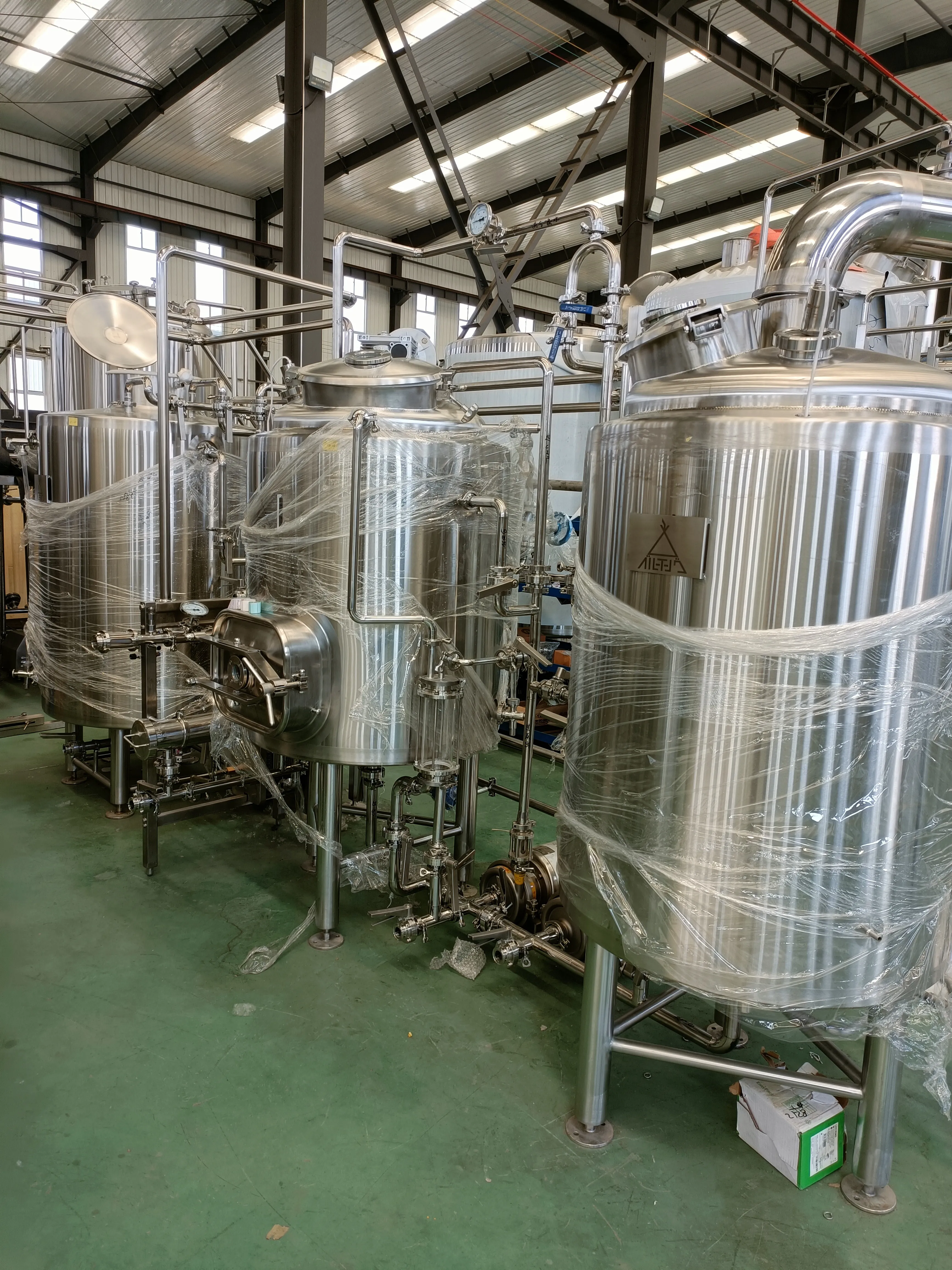 Kichi LLC taproom with visible 2BBL brewing area