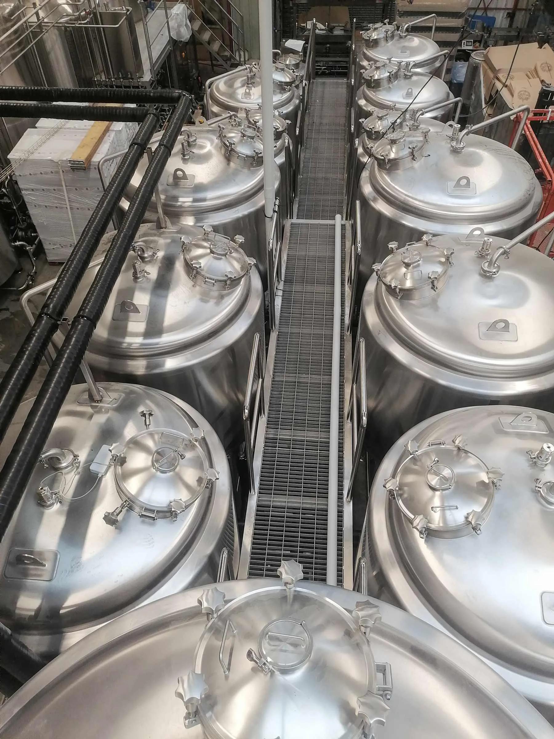 Stainless steel fermentation tanks at LA BRASSERIE DU LOUP BLANC 10HL brewery