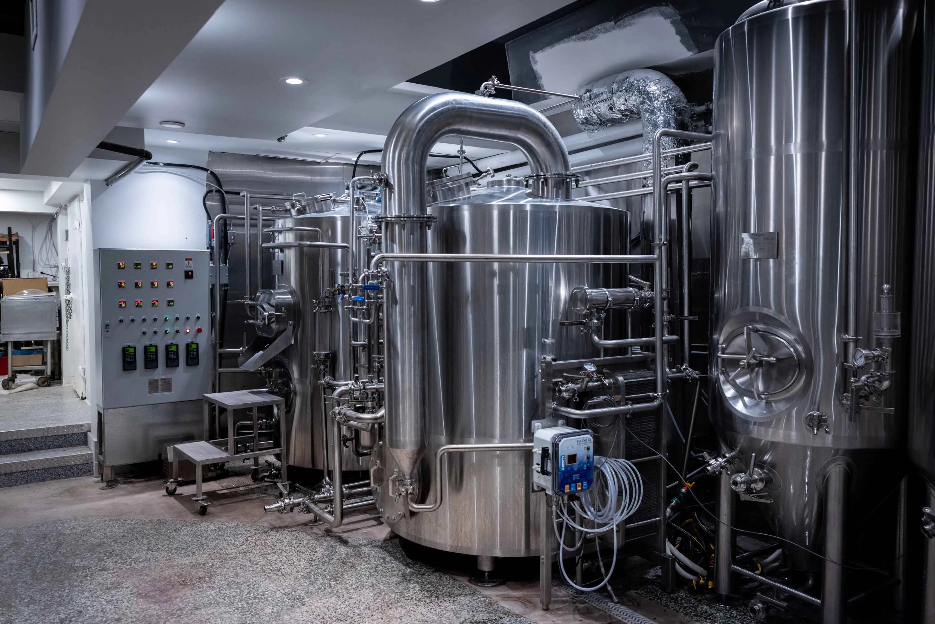 Taberna Nacional brewpub interior with 7BBL brewing system on display